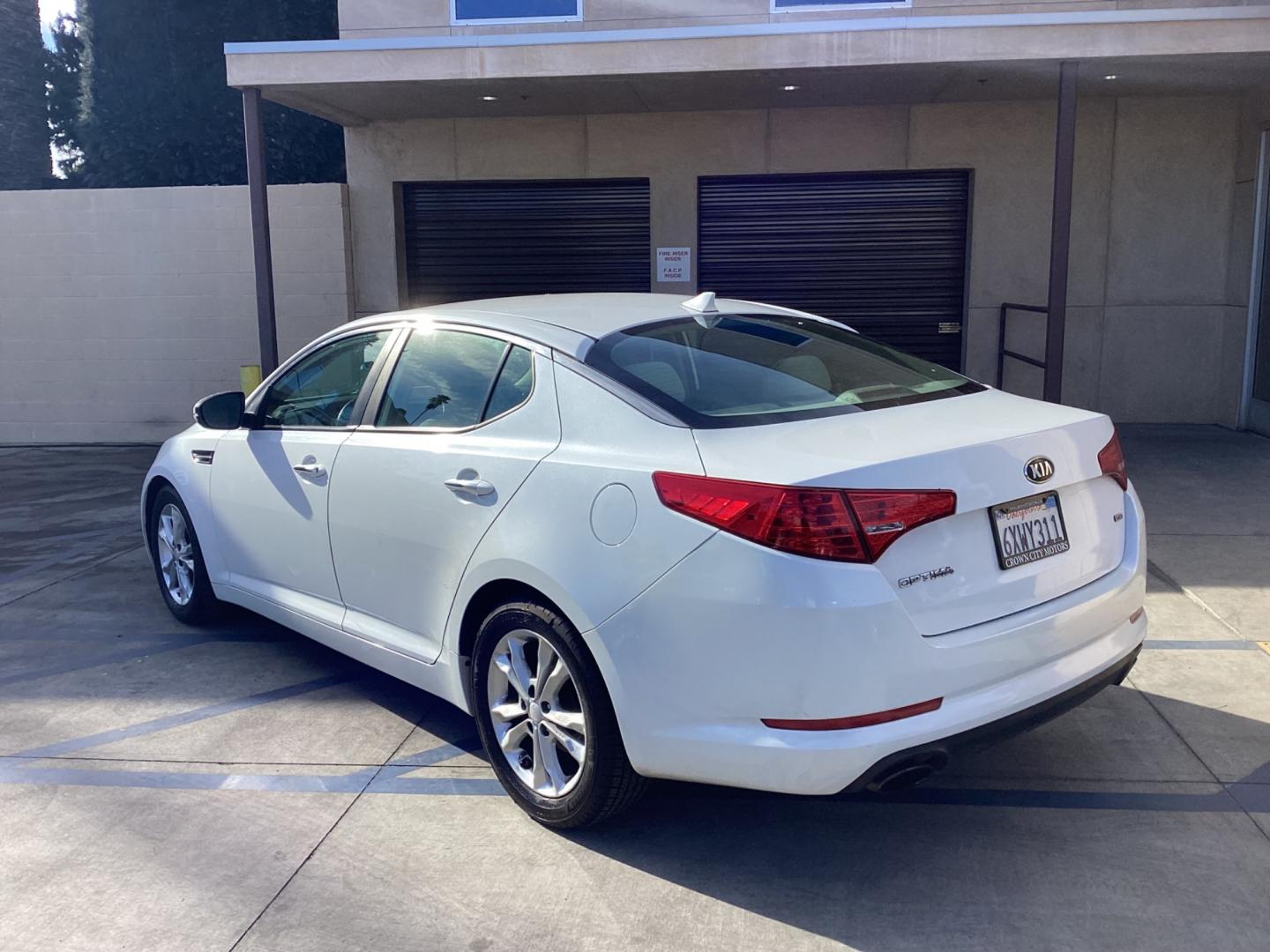 2013 WHITE Kia Optima (5XXGM4A72DG) , AUTOMATIC transmission, located at 30 S. Berkeley Avenue, Pasadena, CA, 91107, (626) 248-7567, 34.145447, -118.109398 - Crown City Motors is a used “Buy Here Pay Here” car dealer in Pasadena CA. “Buy Here Pay Here” financing, means that when you purchase your vehicle from our dealership, that you make the payments to the dealership as well. We do not need the banks approval to get you approved for a used auto - Photo#2